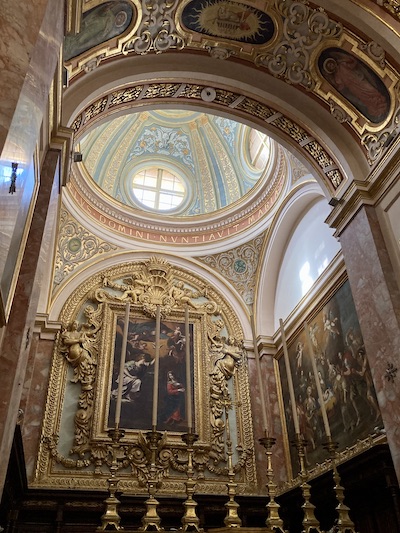 Ornate gold dome roofed alter inside the Carmelite Church in Mdina Malta