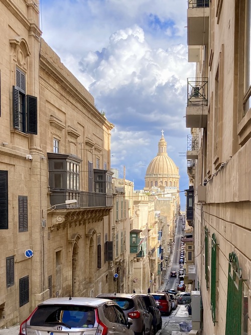 View down a traditional Maltese street to the Basilica of Our Lady of Mount Carmel