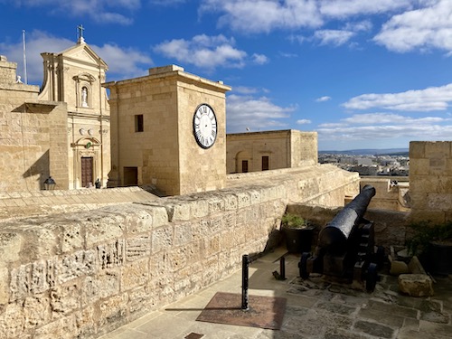 Cannon and clock tower at the Citadel in Gozo Malta