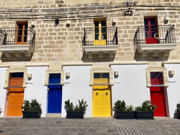 Colourful painted doors along the Marsaxlokk Harbour in Malta