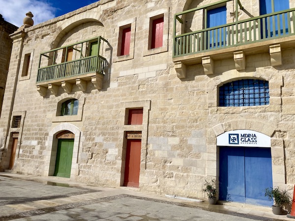 Colourful doors of the old warehouses on the Valletta Waterfront in Malta