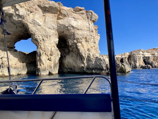 Sea caves from boat to Comino Island in Malta