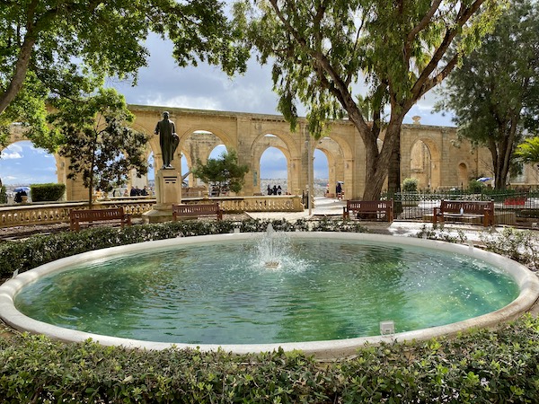 Water fountain and limestone arches at the Upper Barrakka Gardens in Malta