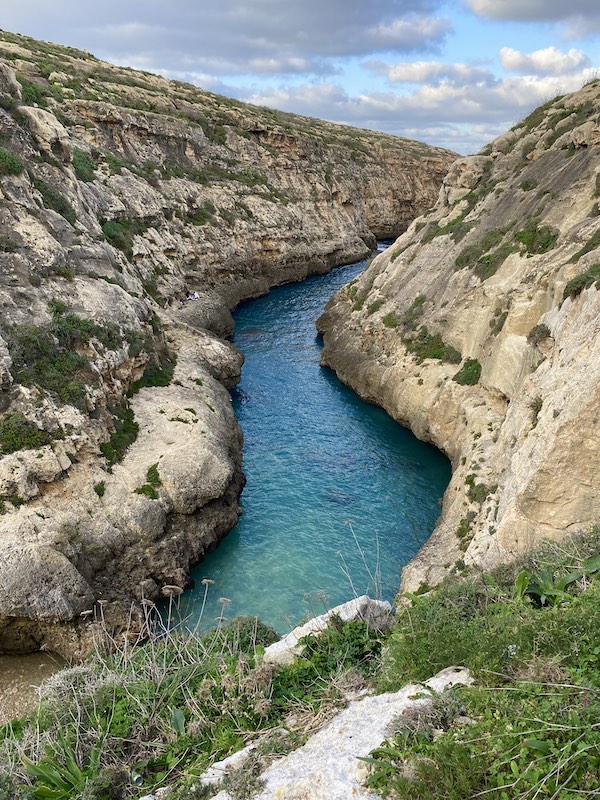 Turquoise gorge rock valley at Wied il-Ghasri in Gozo Malta